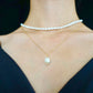 A pearl pendant necklace made of 14K gold-plated sterling silver, paired with a rice pearl strand necklace