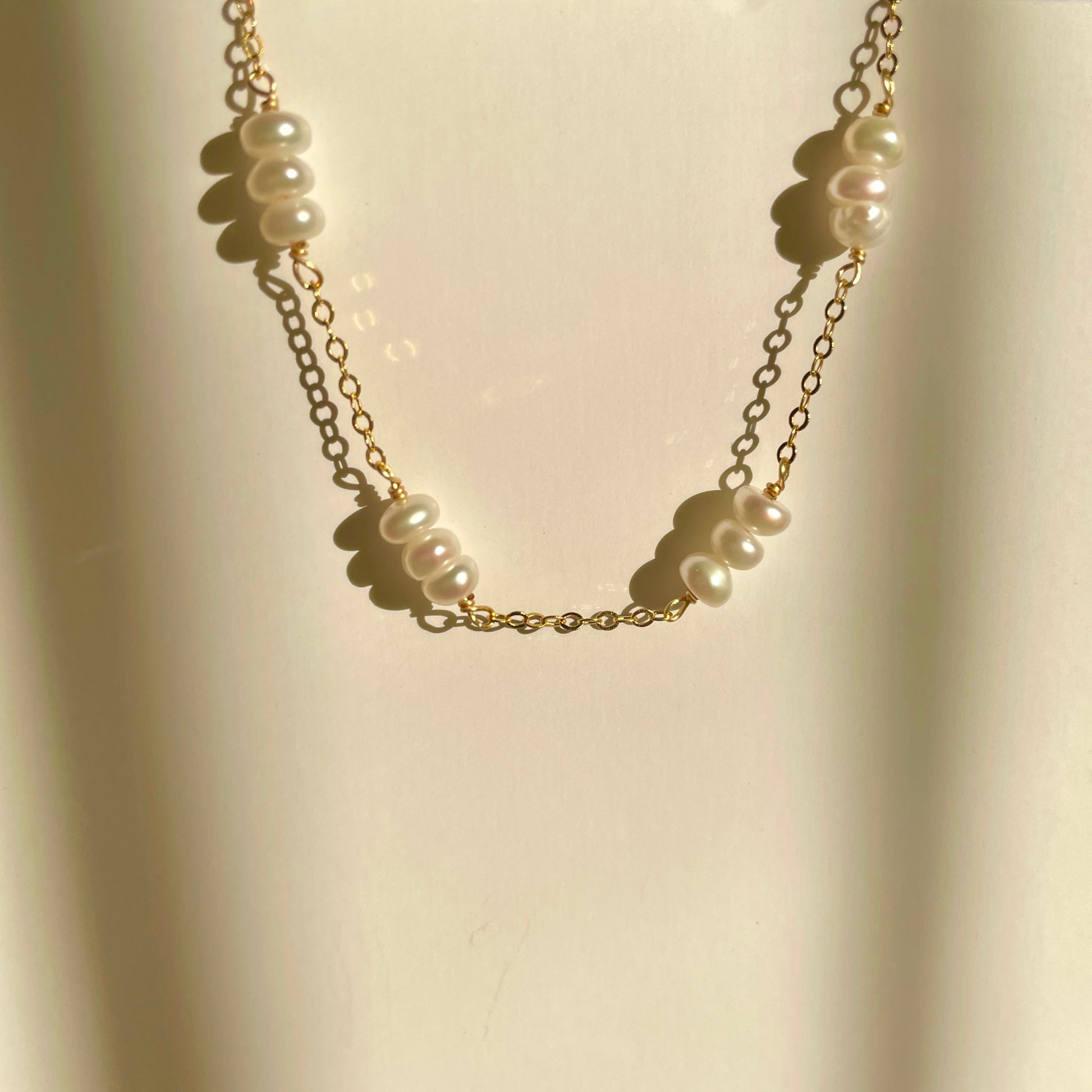 delicate pearl bracelet, with every three small pearls strung together， gold vermeil