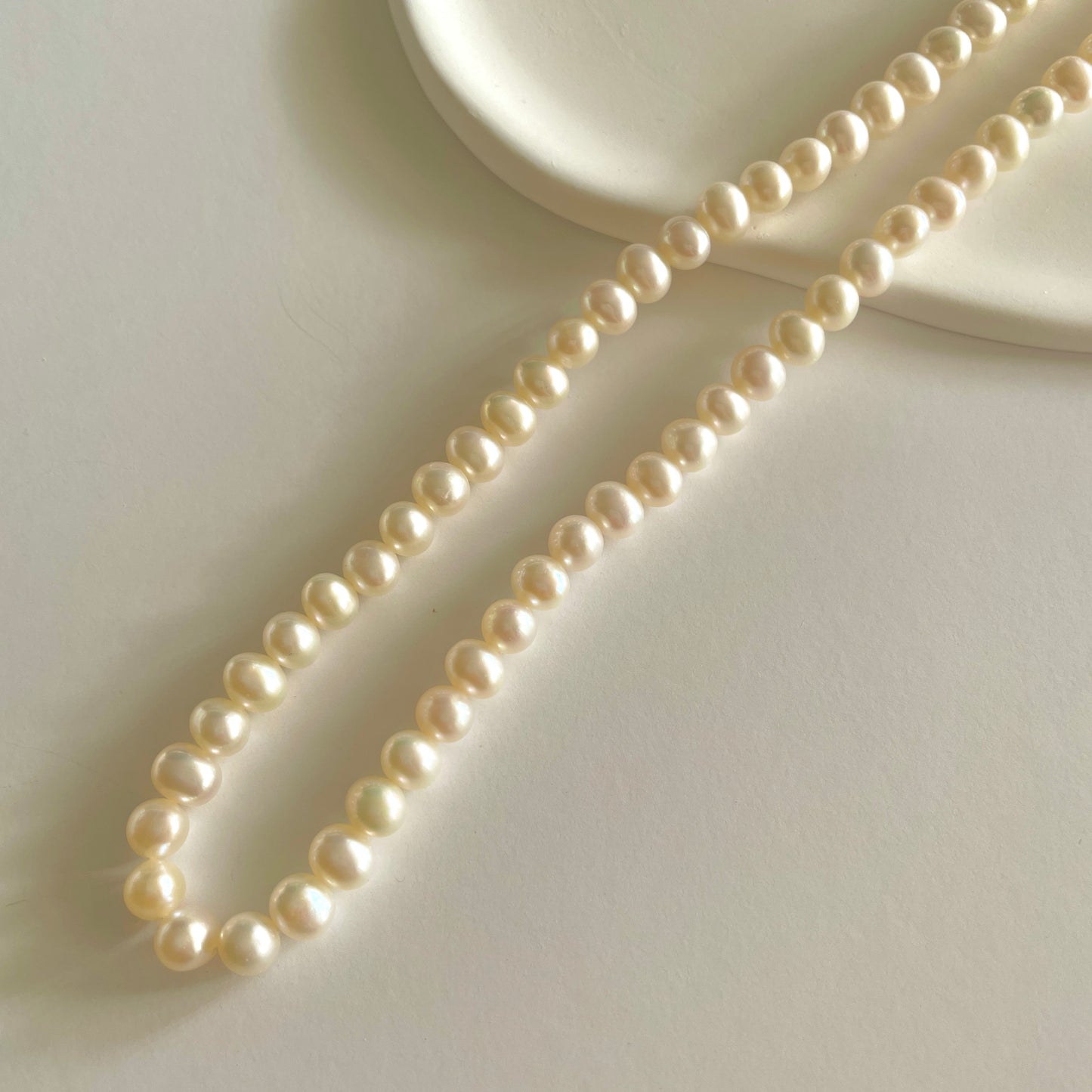 Display of a classic pearl strand necklace