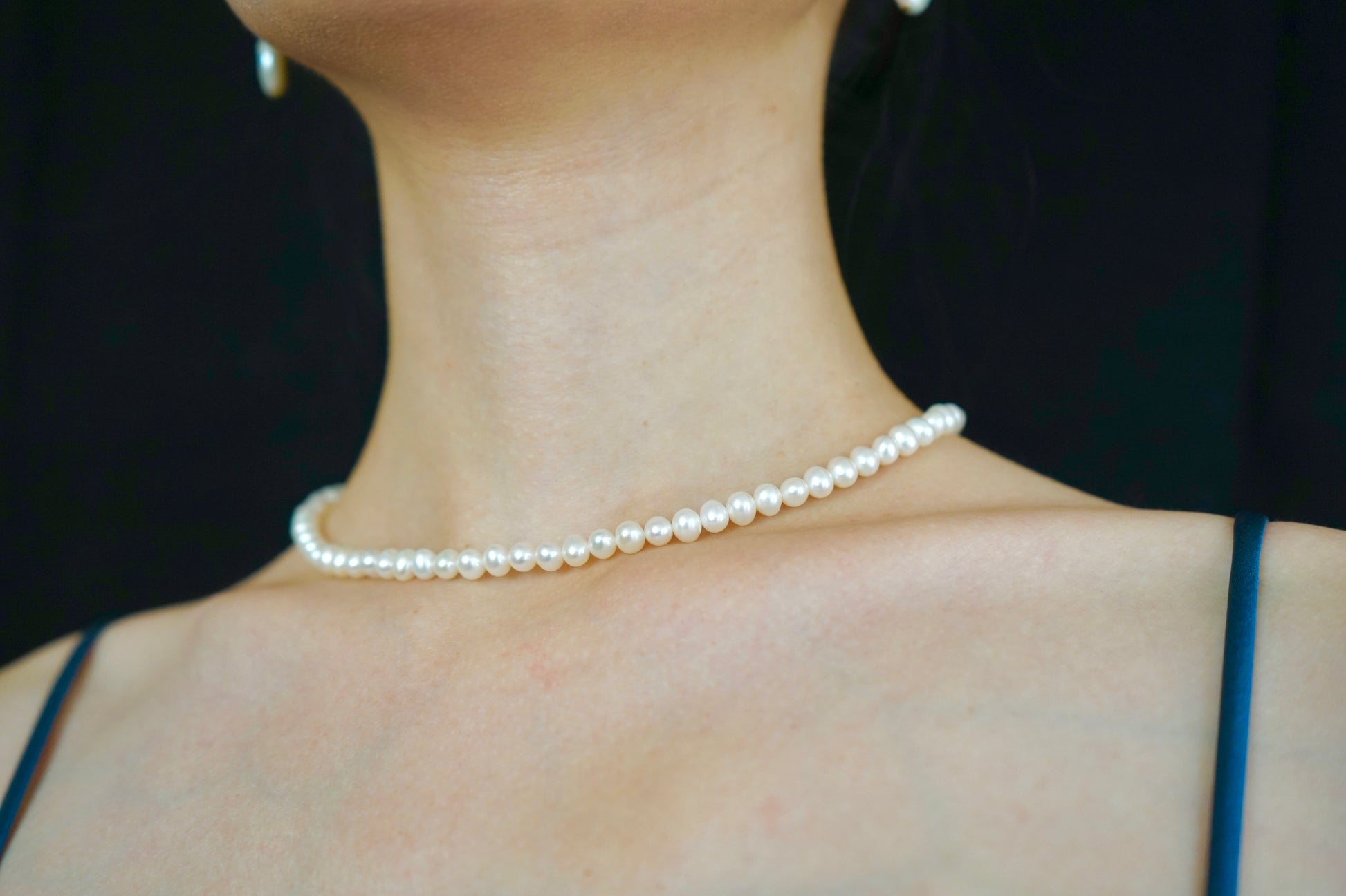 Display of a classic pearl strand necklace