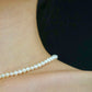 Display of a classic pearl strand necklace