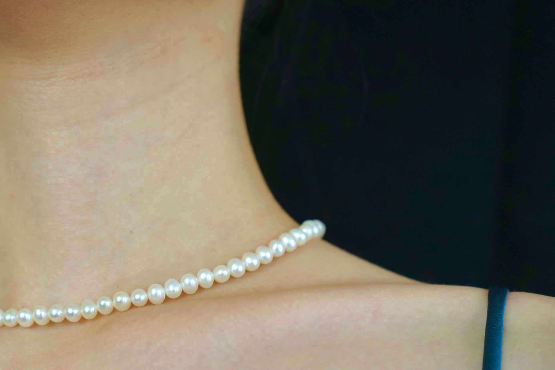 Display of a classic pearl strand necklace