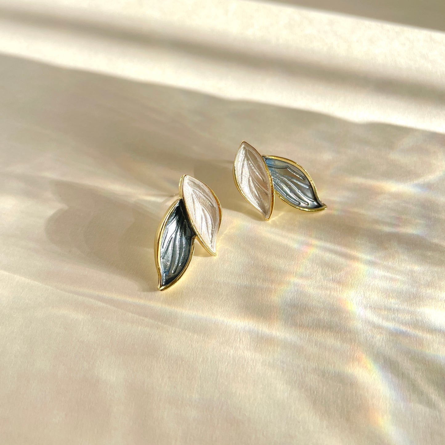 Blue and white leaf-shaped earrings