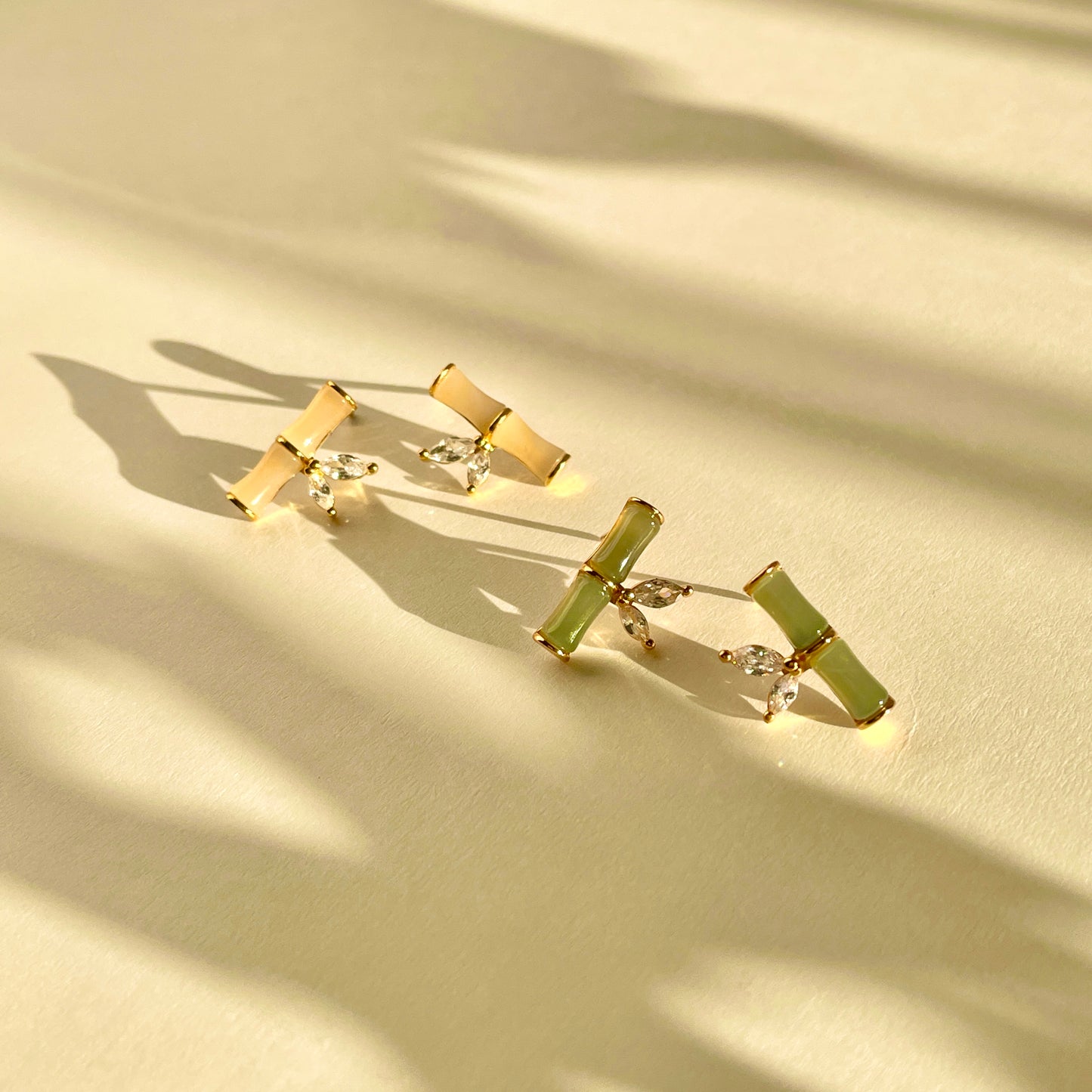 Bamboo-shaped Hetian jade earrings with zircon leaf accents