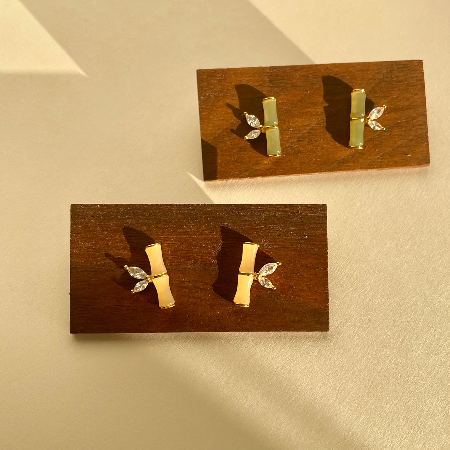 Bamboo-shaped Hetian jade earrings with zircon leaf accents