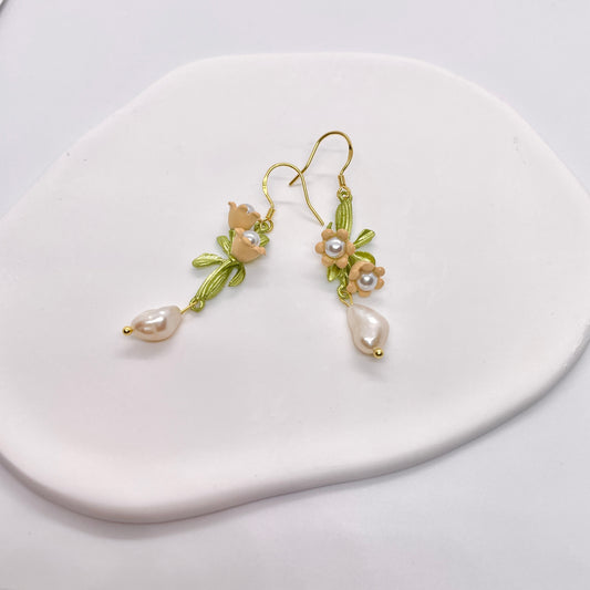 Magnolia flower earrings with Baroque pearls, blooming flowers in shades of pink and green